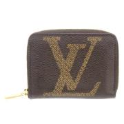Pre-owned Brunt skinn Louis Vuitton lommebok