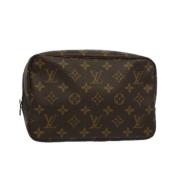 Pre-owned Brunbelagt lerret Louis Vuitton Clutch