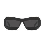 Solbriller med uregelmessig form i svart med mørkegrå linser