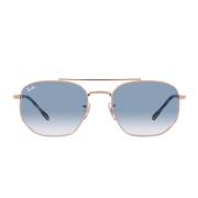 Solbriller med uregelmessig metallramme og blå gradient krystalllinser