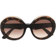 Stilige solbriller med brun/hawaiiansk ramme og ovale linser