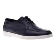 Lace-up in dark blue tumbled leather