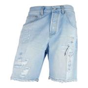 Lysblå Denim Bermuda Shorts med Tårer og Slitasje