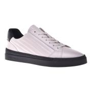 Trainers in white quilted leather and leather